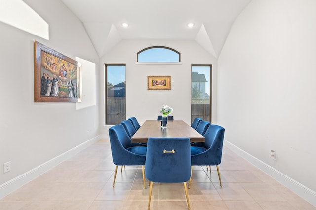 dining room featuring lofted ceiling, light tile patterned floors, baseboards, and recessed lighting