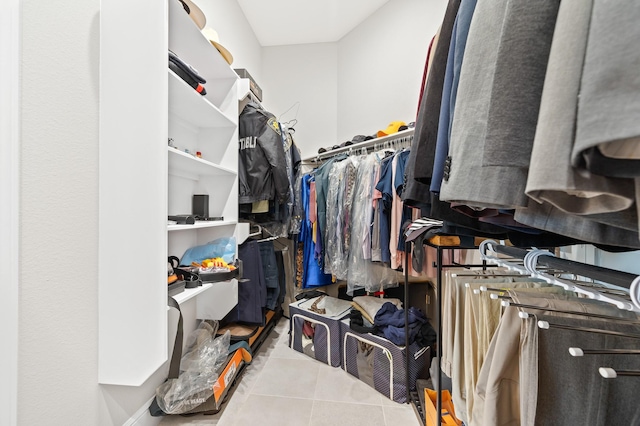 spacious closet featuring tile patterned floors