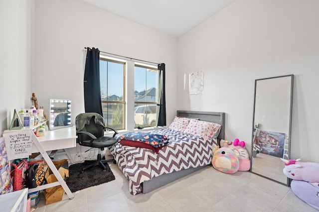 bedroom with tile patterned floors