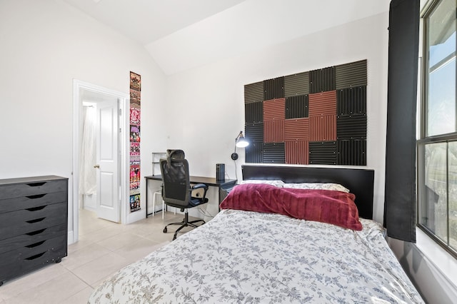 tiled bedroom featuring baseboards and vaulted ceiling