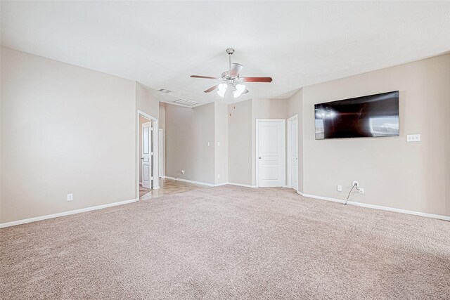 unfurnished room featuring light carpet, ceiling fan, visible vents, and baseboards