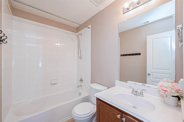 full bath featuring toilet, vanity, visible vents, and shower / bathtub combination