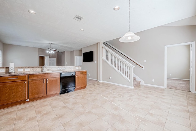 kitchen featuring a sink, visible vents, baseboards, black dishwasher, and brown cabinetry