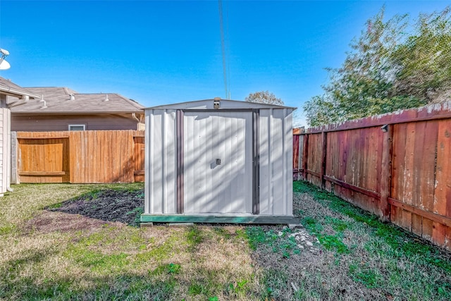 view of shed with a fenced backyard