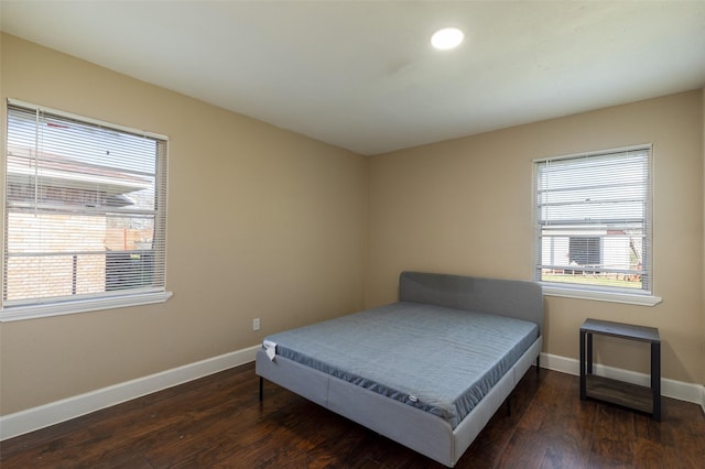 bedroom featuring recessed lighting, baseboards, and wood finished floors