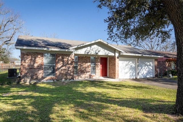 single story home featuring driveway, a front lawn, central AC, a garage, and brick siding