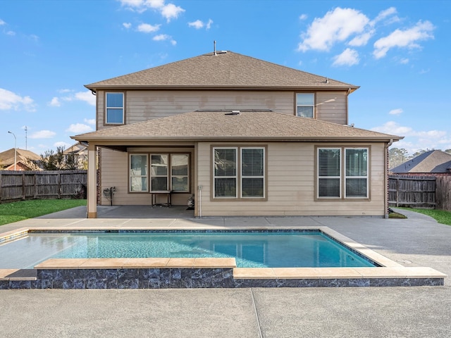 rear view of house featuring a fenced backyard, a patio area, a shingled roof, a fenced in pool, and a hot tub