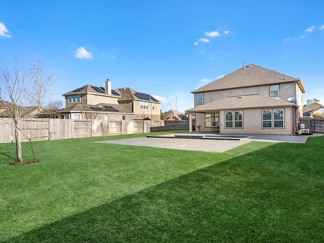 rear view of property with a patio area, a lawn, and a fenced backyard