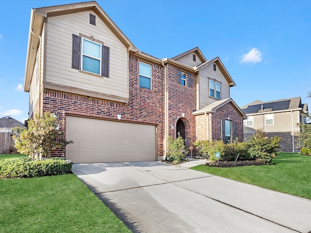 traditional-style home featuring a garage, brick siding, concrete driveway, and a front yard