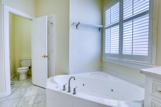 full bathroom featuring toilet, a whirlpool tub, and a wealth of natural light