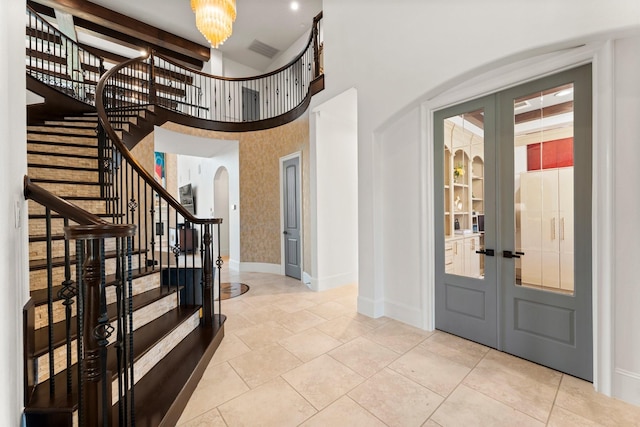 5006 Water View Bnd, Sugar Land, TX 77479 - entryway with arched walkways, stairs, french doors, baseboards, and a high ceiling