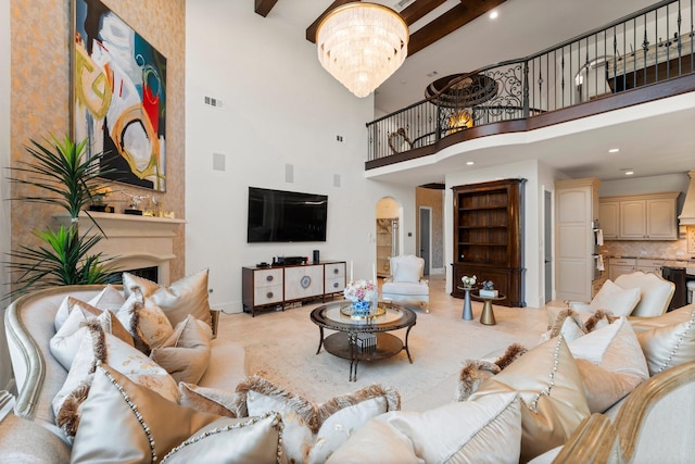 5006 Water View Bnd, Sugar Land, TX 77479 - living room with a high ceiling, a chandelier, baseboards, beam ceiling, and recessed lighting