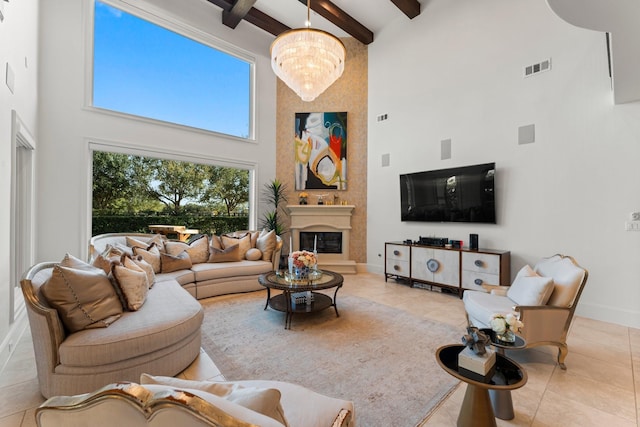 living area with a large fireplace, a high ceiling, beam ceiling, and an inviting chandelier