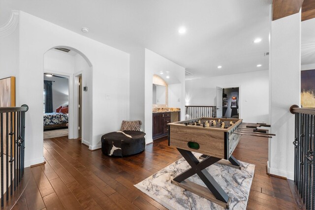 5006 Water View Bnd, Sugar Land, TX 77479 - rec room with arched walkways, dark wood-type flooring, baseboards, and recessed lighting
