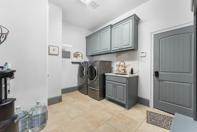 5006 Water View Bnd, Sugar Land, TX 77479 - laundry room with washing machine and dryer, cabinet space, and baseboards