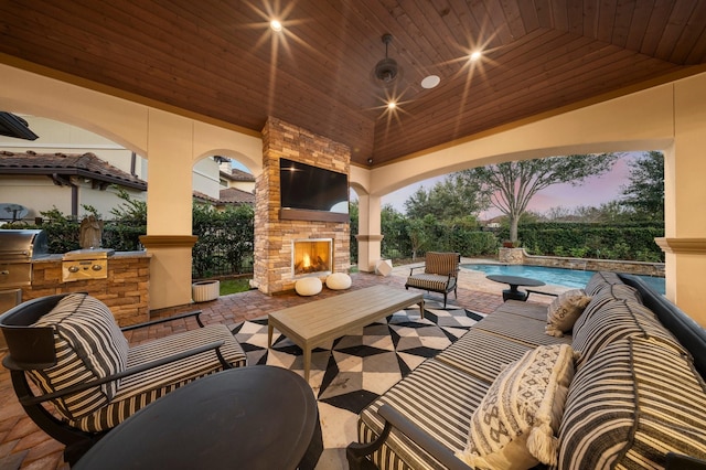 5006 Water View Bnd, Sugar Land, TX 77479 - view of patio / terrace with exterior kitchen, an outdoor living space with a fireplace, an outdoor pool, and a grill