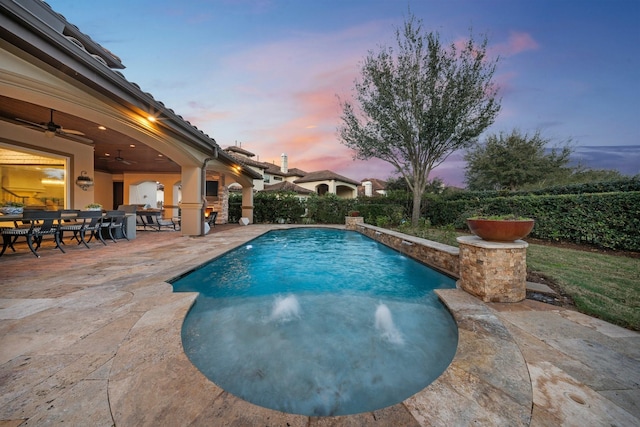 view of pool featuring a fenced in pool, outdoor dining area, a patio area, and ceiling fan