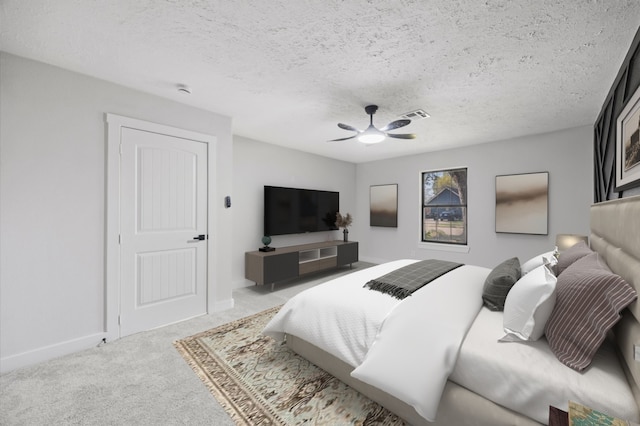 bedroom featuring visible vents, baseboards, ceiling fan, carpet flooring, and a textured ceiling