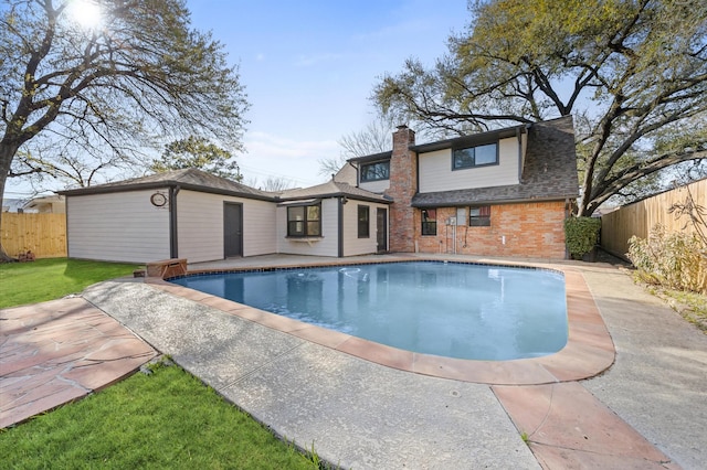 view of swimming pool featuring a patio area, a fenced in pool, and a fenced backyard