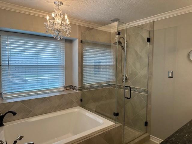 bathroom with a bath, a shower stall, and crown molding