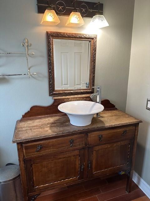 bathroom featuring wood finished floors and vanity