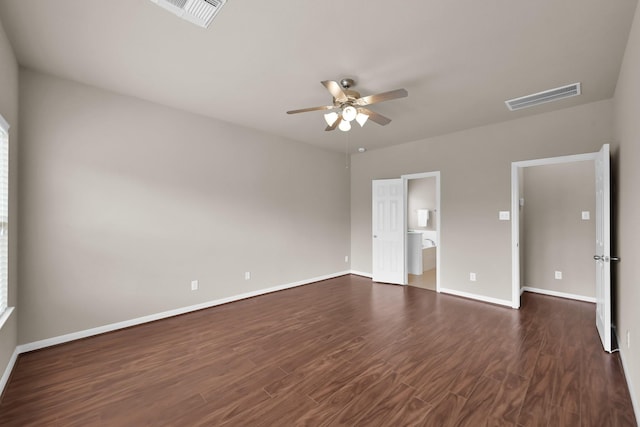 unfurnished bedroom with dark wood-type flooring, visible vents, baseboards, and a ceiling fan