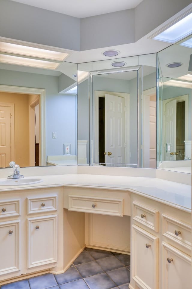 bathroom featuring tile patterned floors and vanity