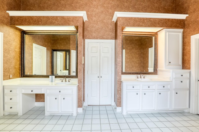 bathroom with two vanities, a sink, and tile patterned floors