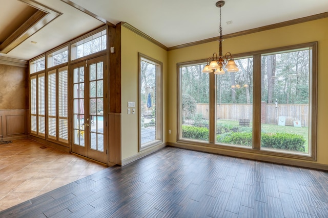 unfurnished sunroom with a chandelier and plenty of natural light