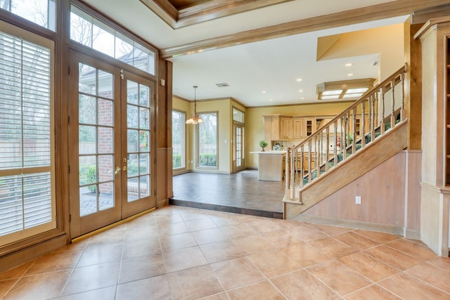 entrance foyer with light tile patterned floors, recessed lighting, stairs, french doors, and crown molding