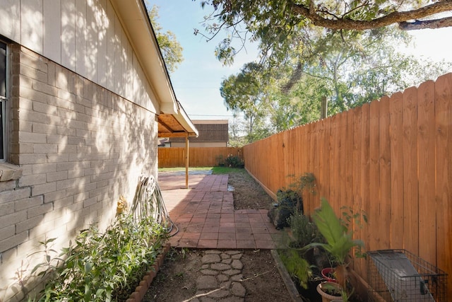 exterior space with a patio and a fenced backyard