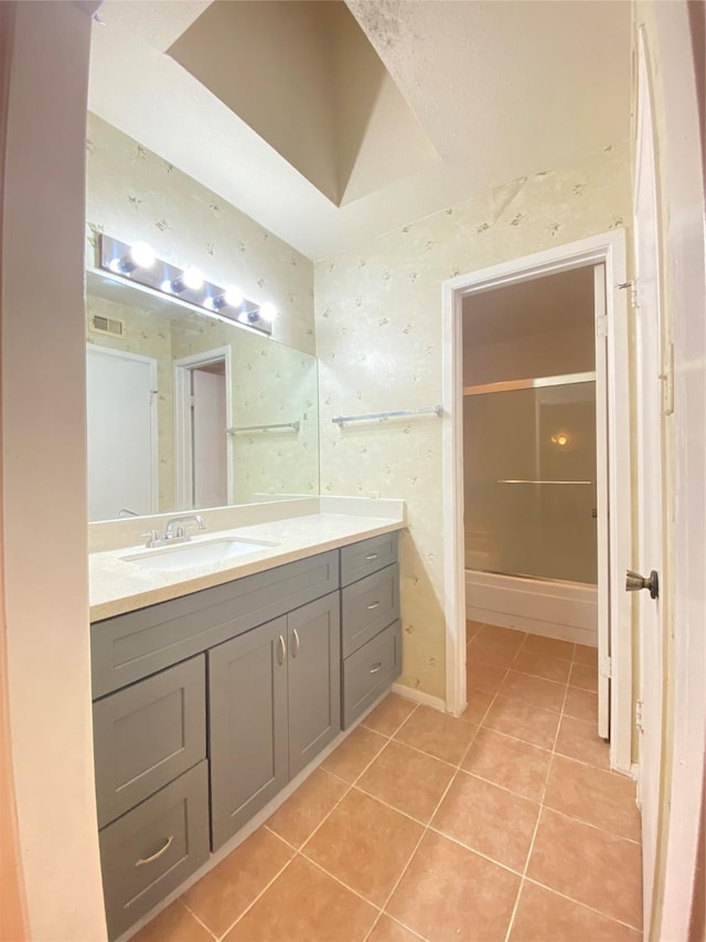 bathroom featuring visible vents, vanity, and tile patterned floors