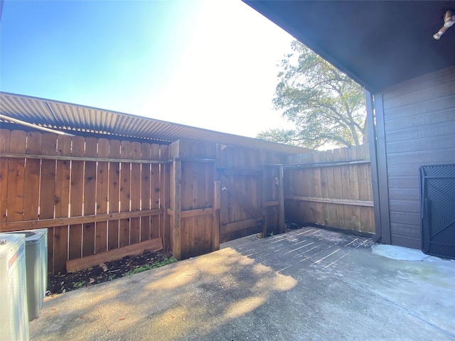 view of patio / terrace featuring fence and a gate