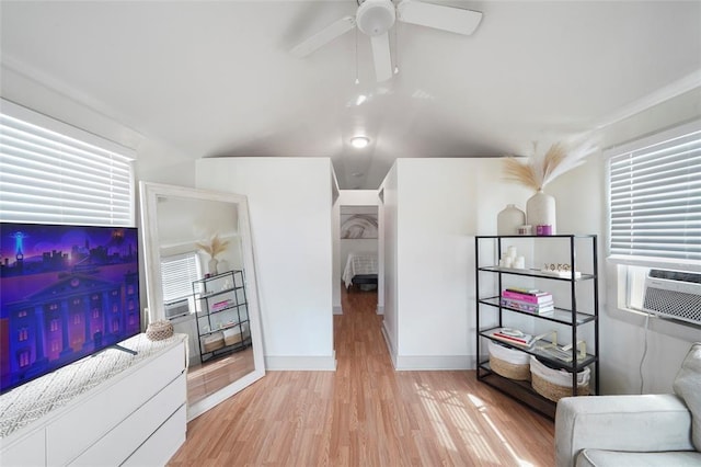 living room with light wood-type flooring, cooling unit, plenty of natural light, and ceiling fan