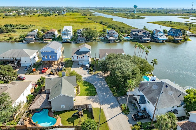 birds eye view of property featuring a water view and a residential view