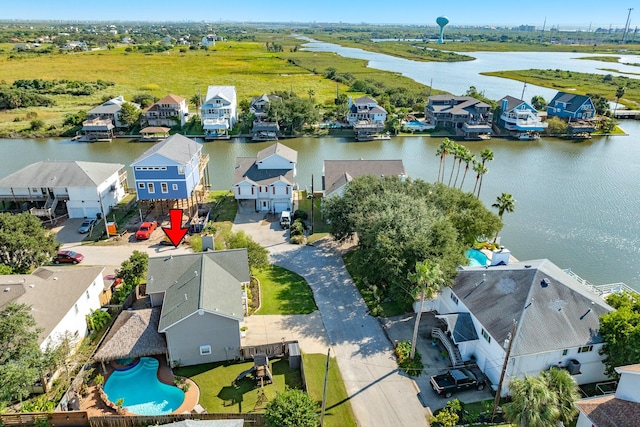 birds eye view of property with a water view and a residential view