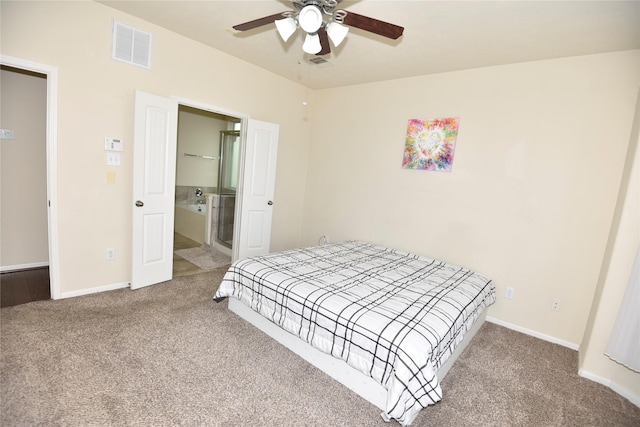 bedroom featuring carpet flooring, a ceiling fan, visible vents, baseboards, and ensuite bath