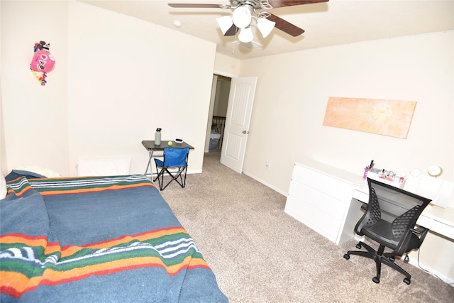 carpeted bedroom with a ceiling fan and baseboards