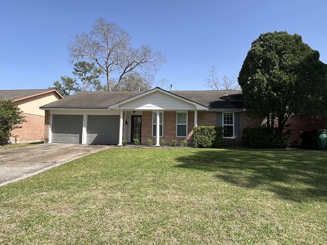 ranch-style home with a garage, concrete driveway, a front lawn, and brick siding