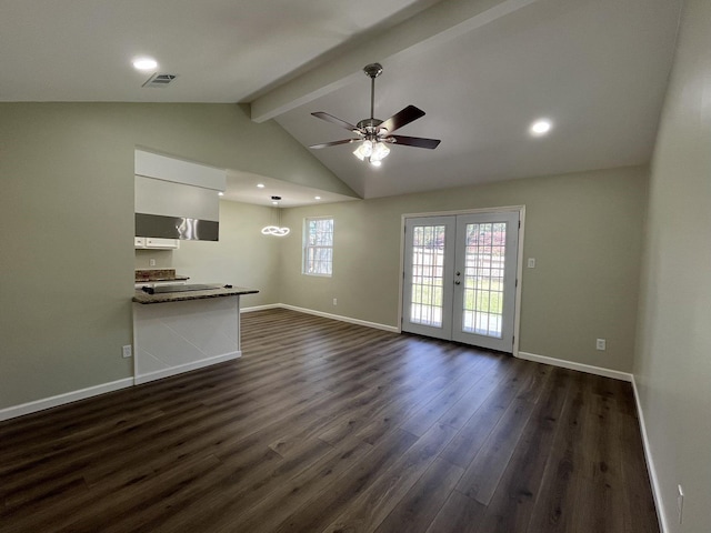 unfurnished living room with french doors, visible vents, lofted ceiling with beams, dark wood-type flooring, and baseboards