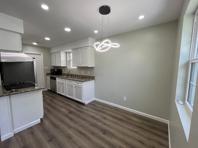 kitchen featuring baseboards, white cabinets, dark stone countertops, dark wood-type flooring, and black appliances