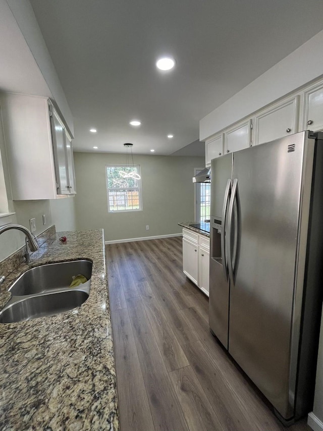 kitchen with recessed lighting, a sink, white cabinetry, stainless steel refrigerator with ice dispenser, and dark wood finished floors