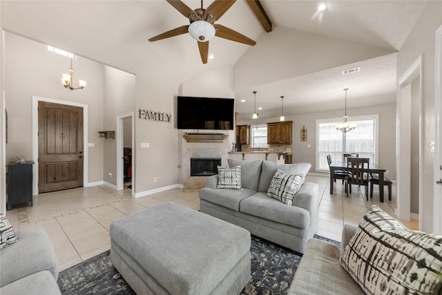 living area with visible vents, a tile fireplace, high vaulted ceiling, beam ceiling, and light tile patterned flooring