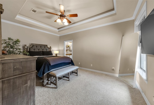 bedroom featuring light carpet, visible vents, baseboards, a tray ceiling, and crown molding