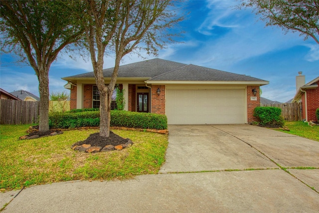 single story home featuring driveway, brick siding, an attached garage, and fence