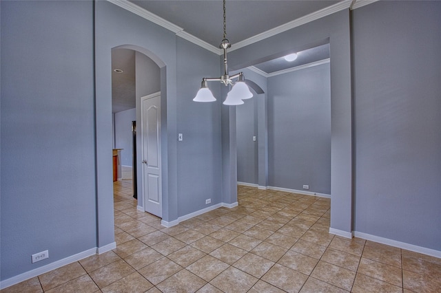 unfurnished dining area with baseboards, arched walkways, crown molding, and light tile patterned flooring