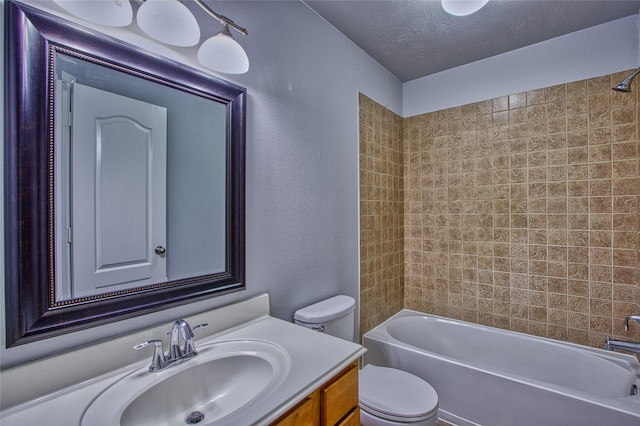 bathroom with a textured wall, toilet, shower / tub combination, a textured ceiling, and vanity