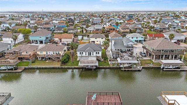 aerial view with a residential view and a water view