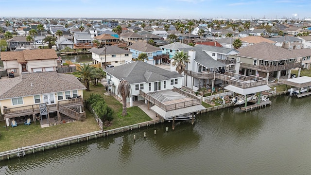 birds eye view of property featuring a residential view and a water view