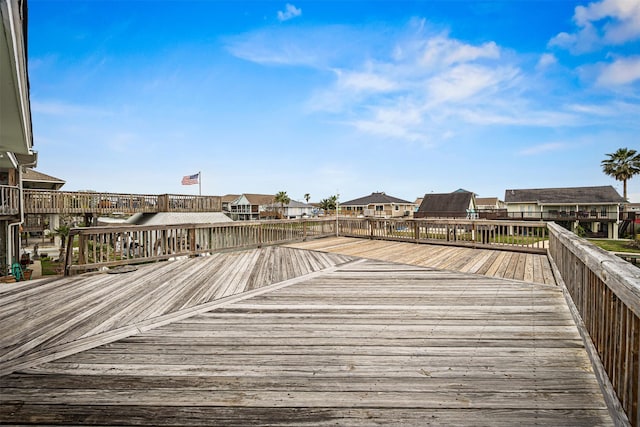 wooden deck featuring a residential view